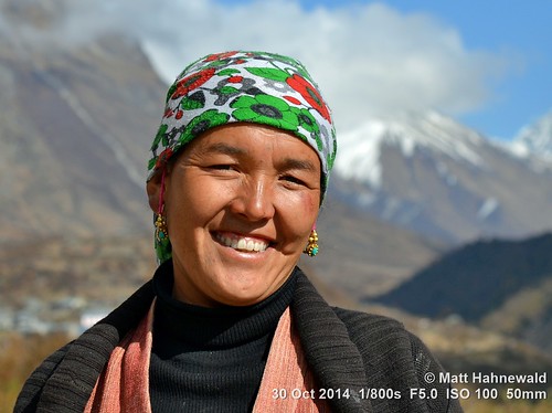photo primelens portrait sunshine cultural character teeth mouth lips consent travel trekking female fun ethnic posing beauty smiling backdrop beautiful attractive headscarf cheerful closeup street color eyes traditional asia matthahnewaldphotography face facingtheworld colorful ghumba himalayas horizontal head langtang nepal nikond3100 outdoor 50mm oneperson seveneighthsview expression headshot earring nepali nikkorafs50mmf18g 4x3ratio 1200x900pixels resized lookingatcamera