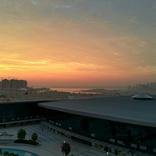 sea sky sun building water sunrise square dawn squareformat doha qatar iphoneography instagramapp uploaded:by=instagram foursquare:venue=4d22ec6a6e8c370487f40fa0