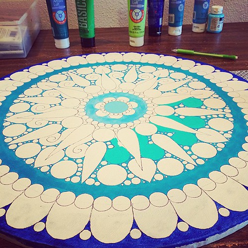My first mandala painting. I inked the design on the canvas so I can fill it in like a coloring book (very satisfying).