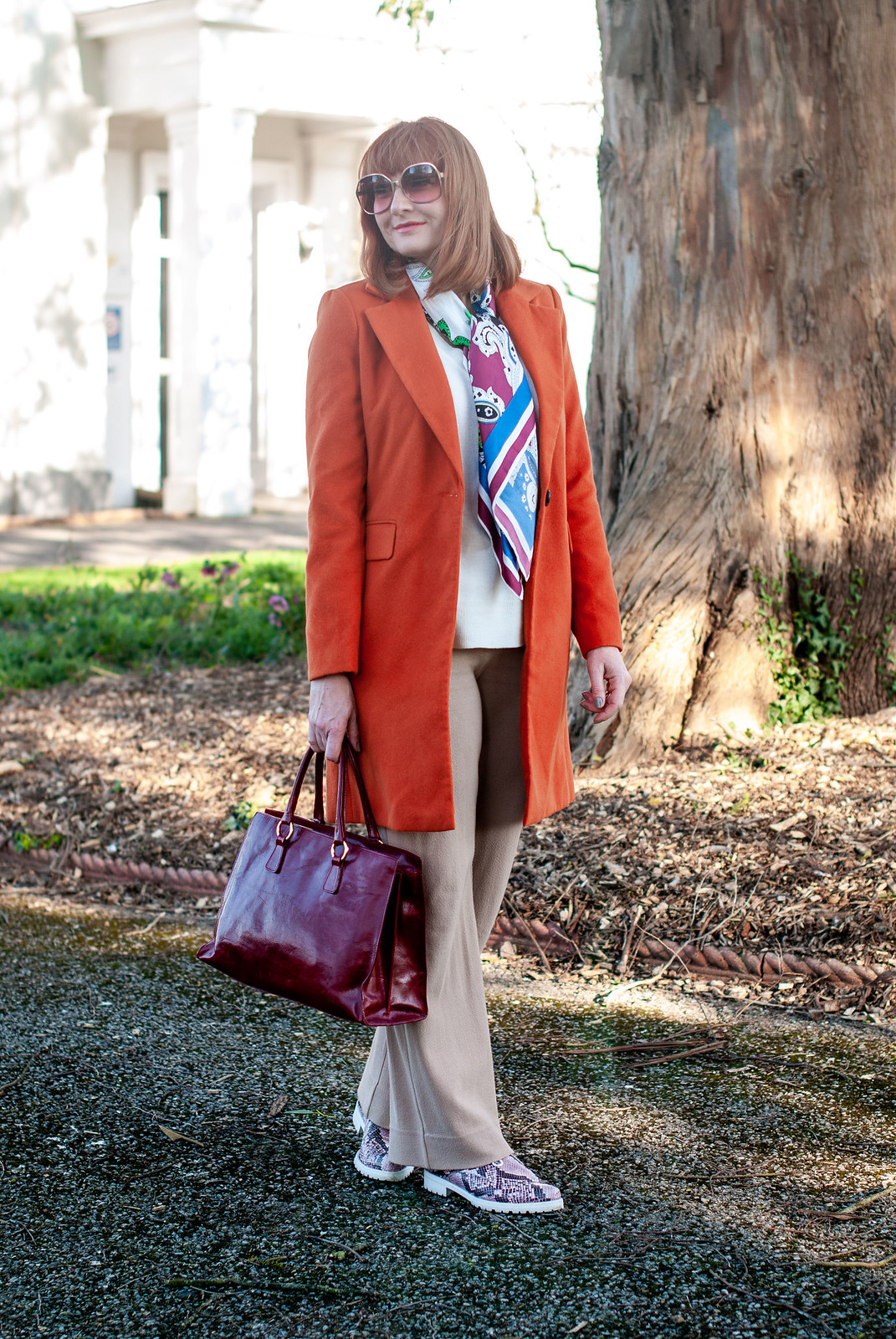 Fashion Over 40: A Longline Coat or Blazer is Your Wardrobe's Best Friend \ longline orange coat \ camel wide leg trousers \ red leather tote bag \ pink snakeskin lace up shoes | Not Dressed As Lamb