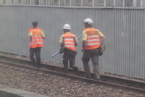 MTR staff at work on the running Tung Chung line tracks north of Kowloon station