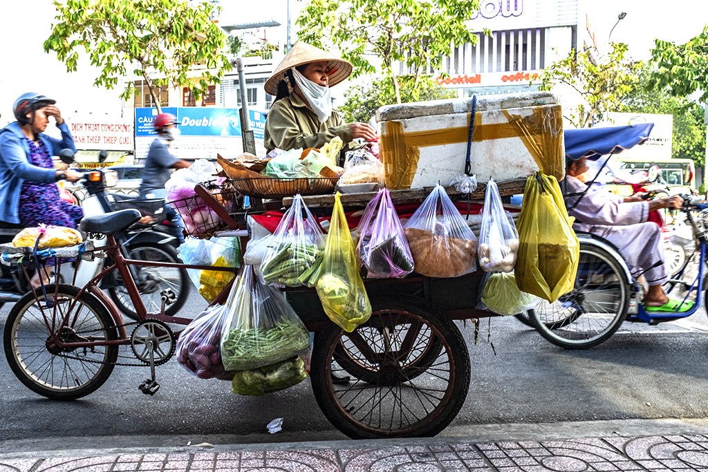 Woman selling vegetables on a peditruck in District 6--Saigon