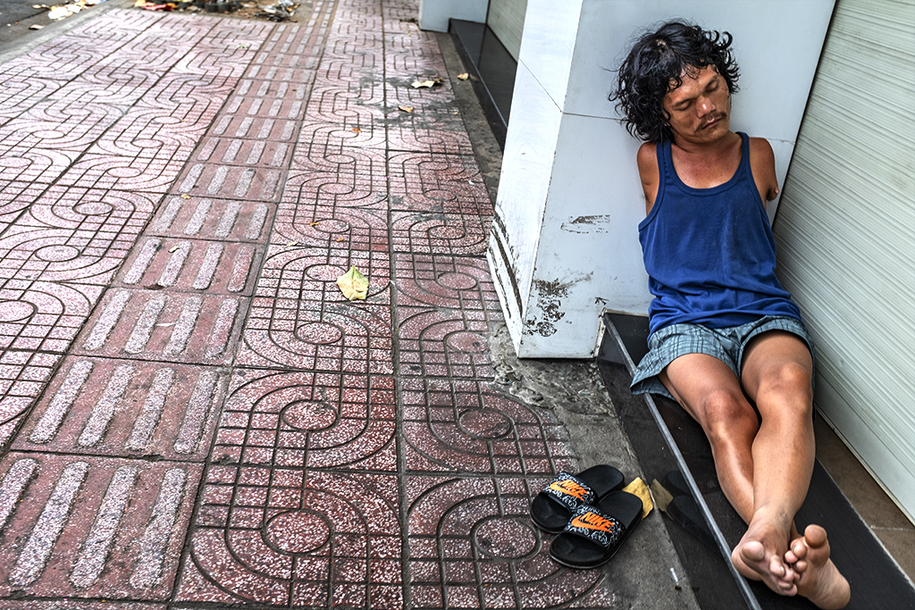 Armless man sleeping on Kinh Duong Vuong--Saigon
