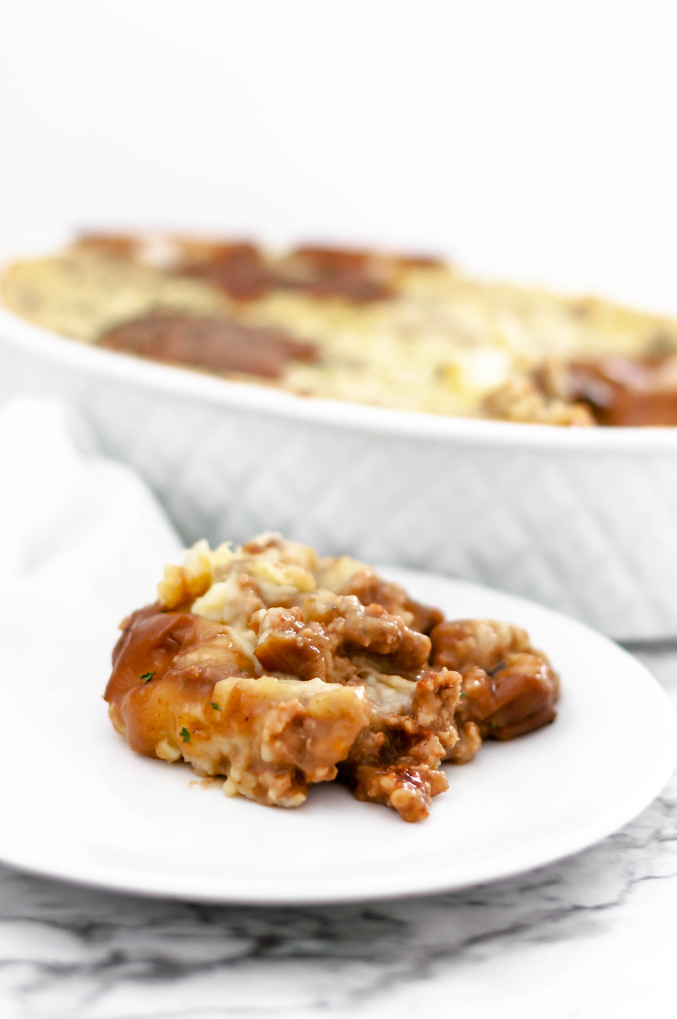 This rich and hearty Bangers and Mash Casserole would be perfect for St. Patrick's Day. All the classic flavors and ingredients of Bangers and Mash combined into a hearty casserole.