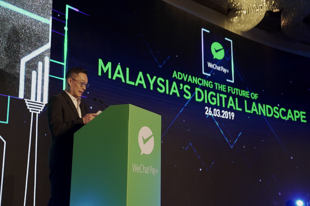 Poshu Yeung, Vice President of International Business Group at Tencent, presenting his speech on WeChat Pay MY’s role in Malaysia’s digital payment landscape.