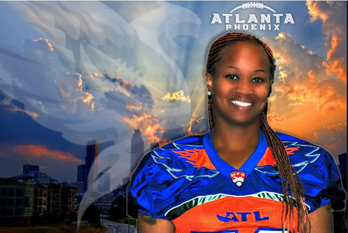 Amber Grant is pictured in her Atlanta Phoenix football jersey in front of an Atlanta skyline and her team’s logo