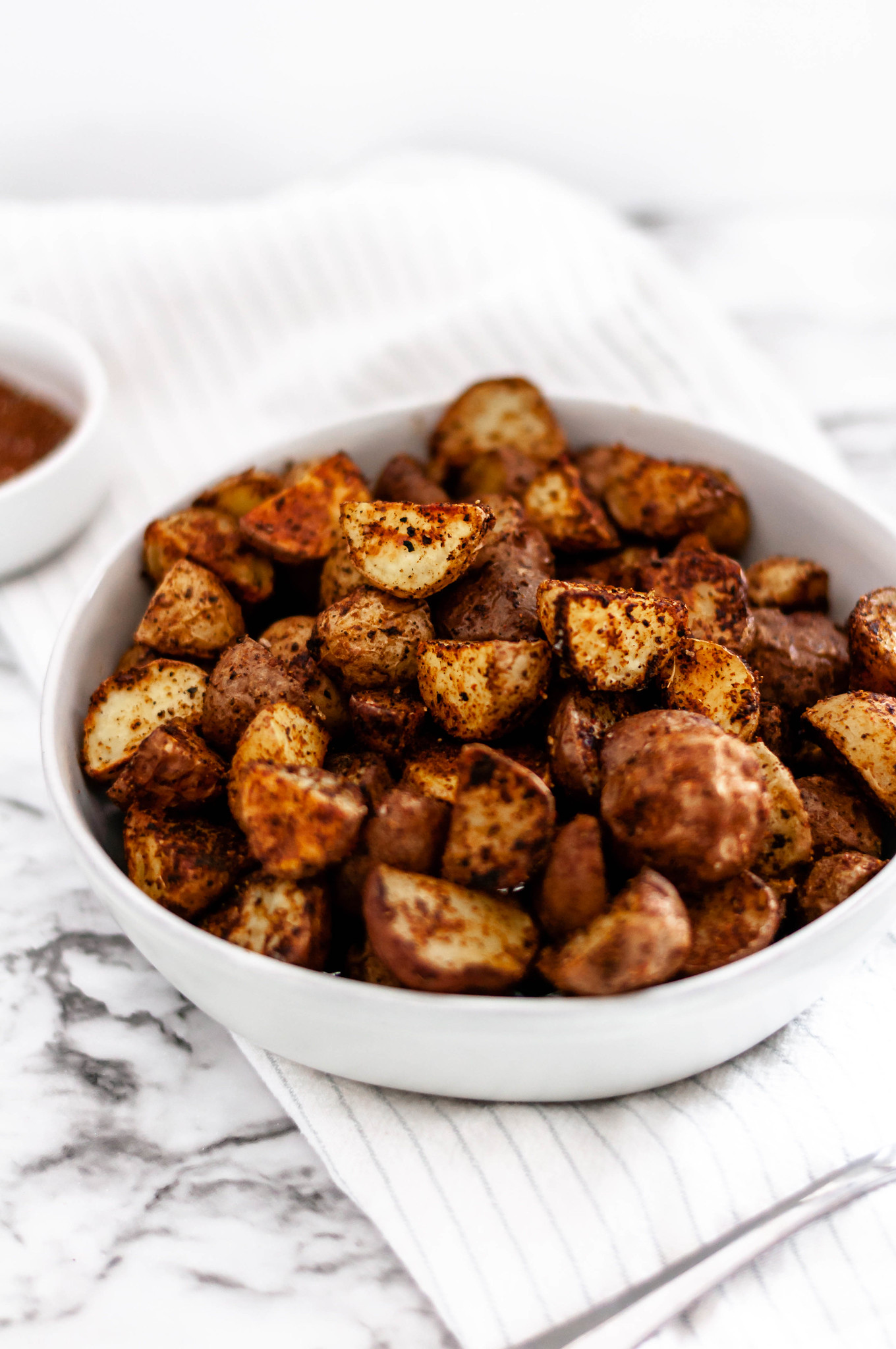 These Taco Roasted Potatoes are spiced up with your favorite taco spices. They make the perfect weeknight side dish, done in less than 30 minutes.