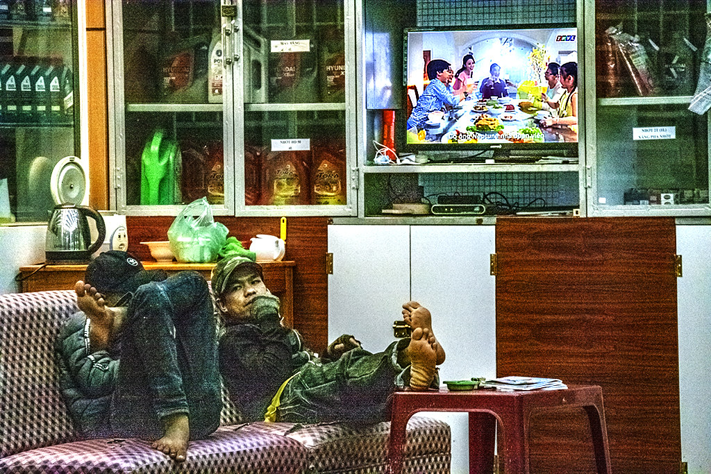 Gas station attendants relaxing--Phu Hoi