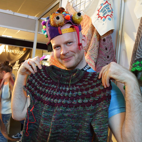 Stephen West at EYF 2019 holding The Bubble Sweater WIP