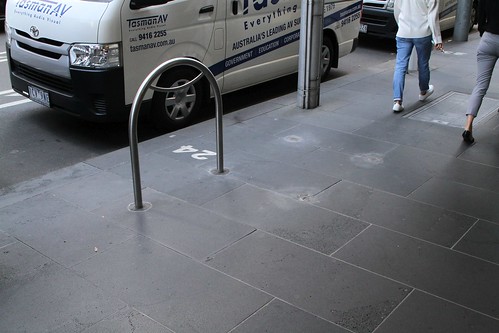 A year after the City of Melbourne said they would move them, the bike hoops at William and Bourke Street are now parallel to the kerb, instead of blocking the footpath