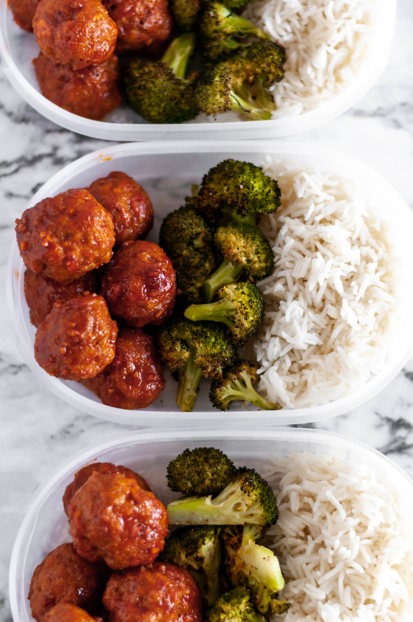 Korean Meatball Meal Prep makes a delicious lunch throughout the week. Baked on a sheet pan along with broccoli. Spicy and so flavorful.