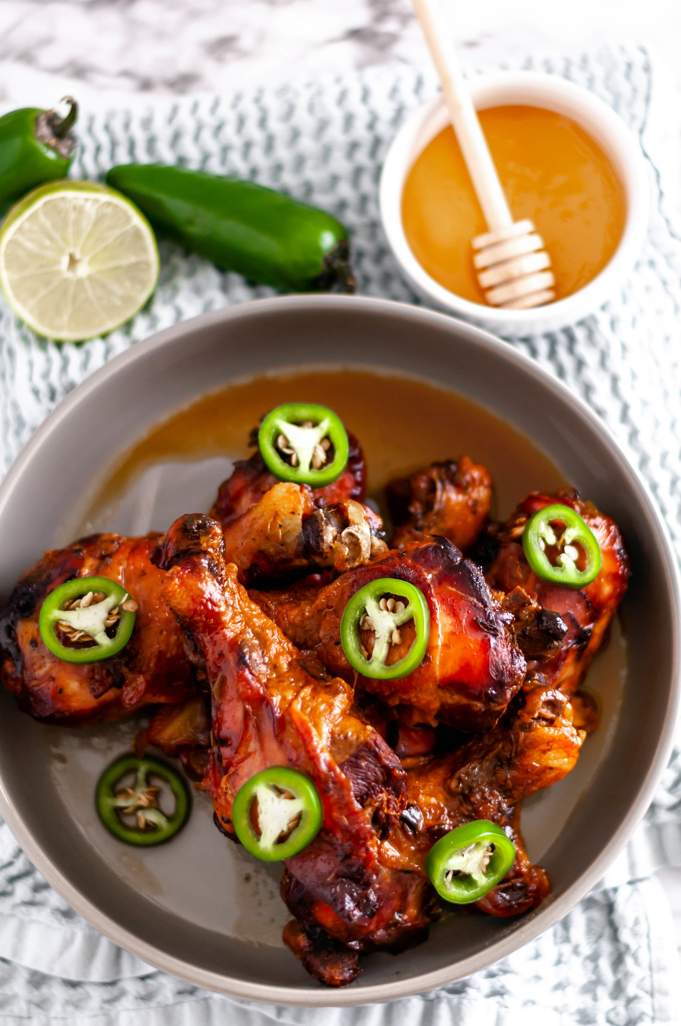 This Slow Cooker Honey Jalapeno Chicken Drumsticks are perfect for busy weeknights. Just a few ingredients tossed into the slow cooker & dinner is served.
