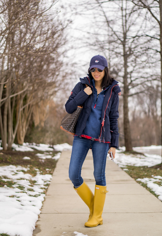 Vineyard Vines baseball cap, Superdry windcheater jacket, Vineyard Vines small quilted relaxed shep shirt, skinny jeans, Goyard Artois MM, Hunter Tour rainboots in fennel seed