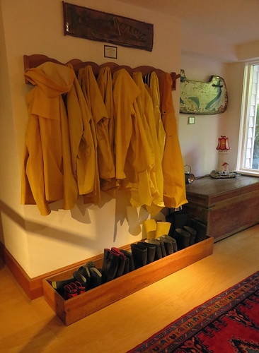 Complementary yellow rain coats and rubber boots at Sooke Harbour House in Sooke on Vancouver Island, Canada