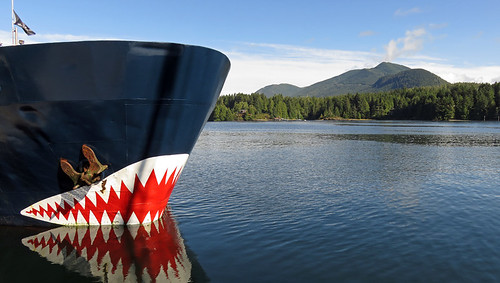 The scary 'Jaws' boat reflected in the water at a wharf in Ucluelet on Vancouver Island, Canada