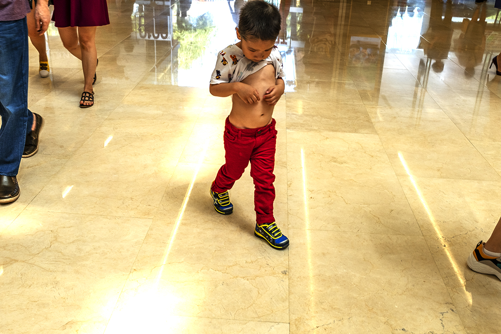 Little boy with shirt pulled up in Saigon Centre--Saigon