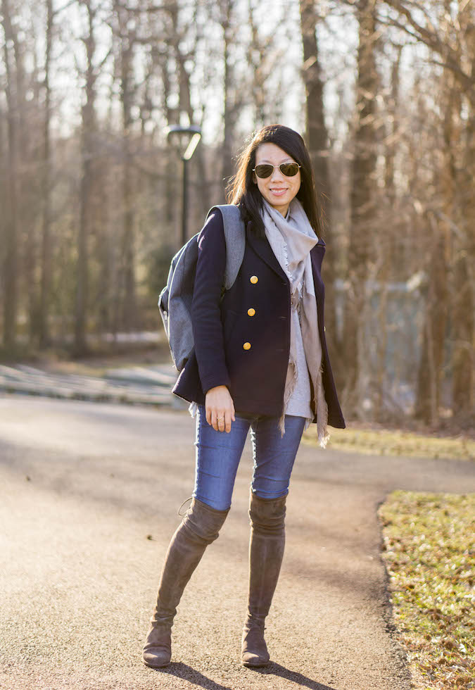 plaid scarf, navy pea coat, Mercedes-Benz backpack, gray top, skinny jeans, Stuart Weitzman Lowland over the knee boots
