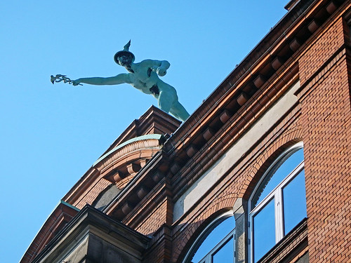 Statue of the winged god Mercury, made of weathered copper (verdigris), in Copenhagen, Denmark