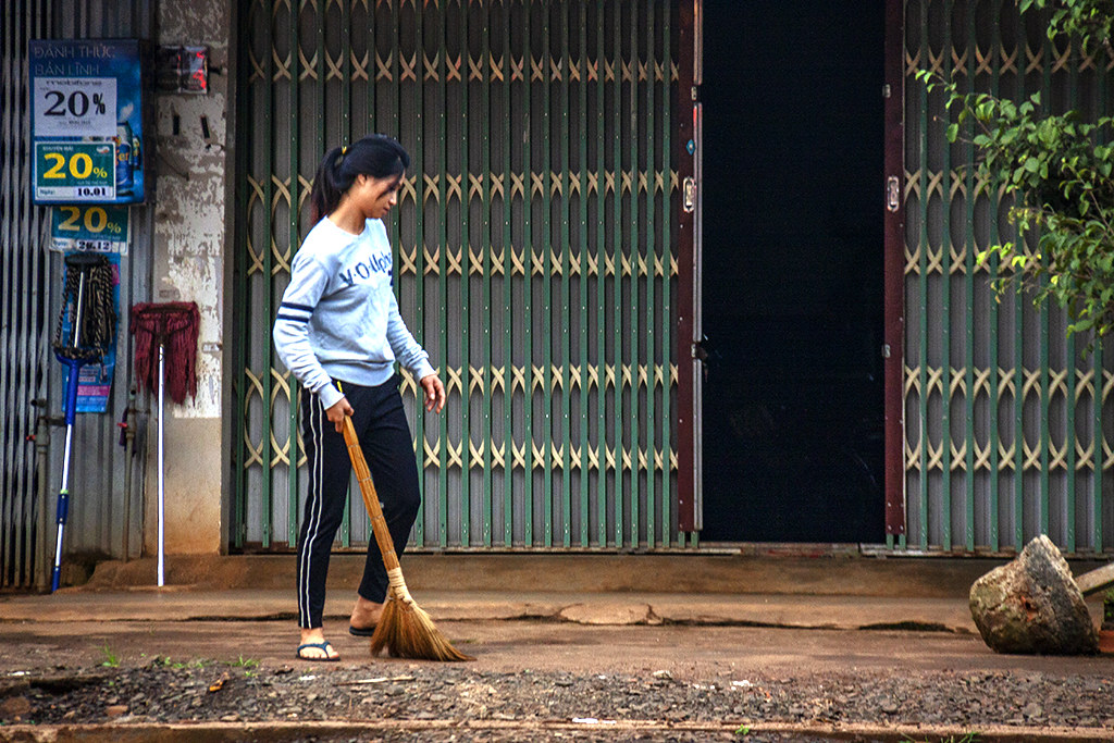 Woman sweeping at 6-39AM--Ea Kly
