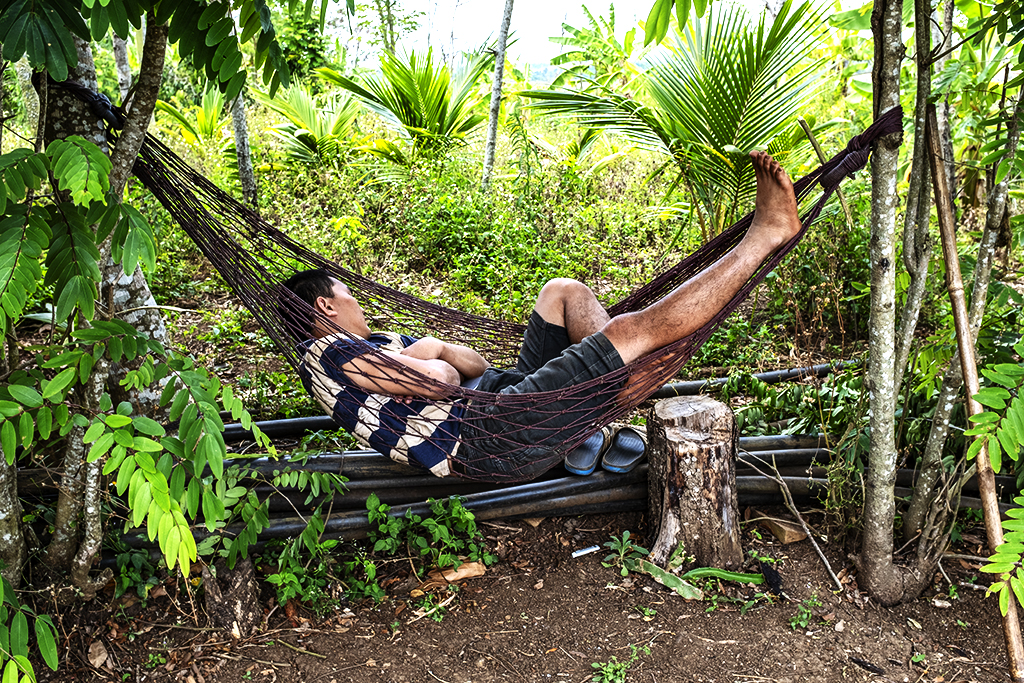 Man on hammock near lake--Krong Buk