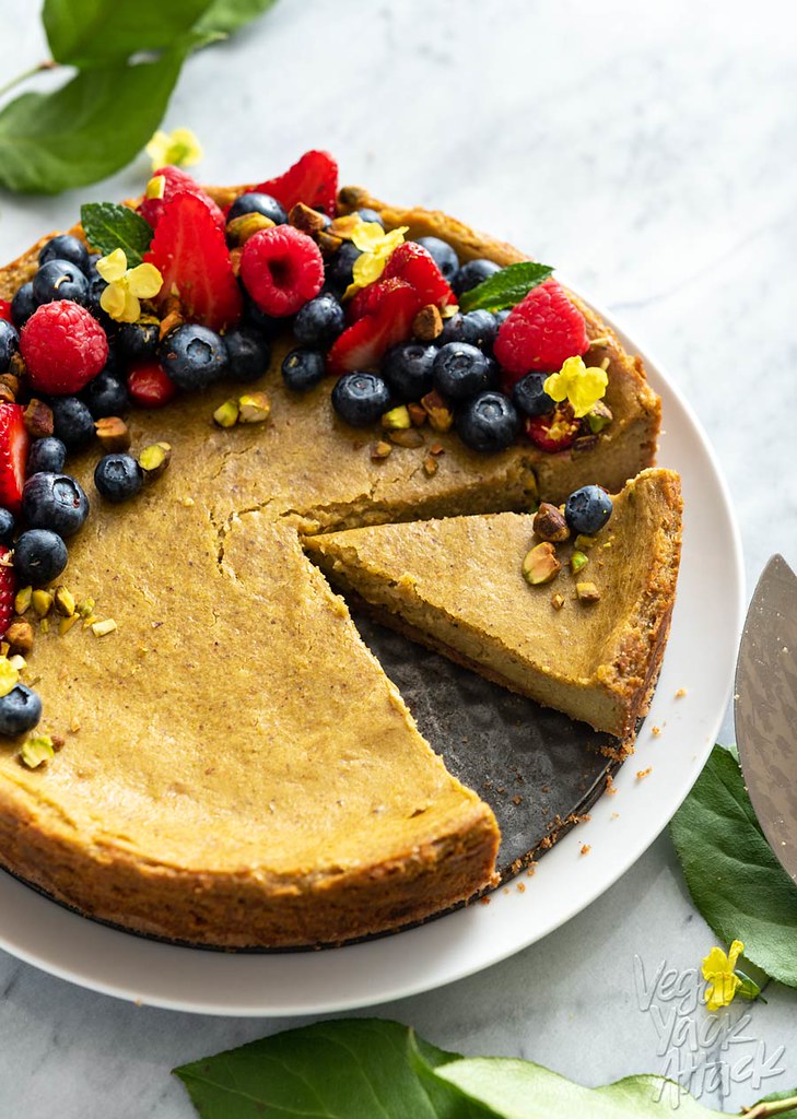 This Gluten-free Pistachio Cheesecake is light green in hue and straight up delicious. Plus, it’s vegan! Top it with some seasonal berries for a pop in flavor and color. #vegan #glutenfree #veganyackattack #cheesecake