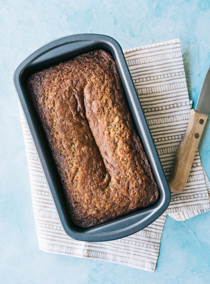 Whole loaf of banana bread in a pan