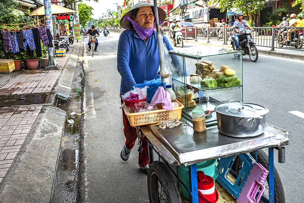 Itinerant seller of banana and mung bean cakes--Saigon
