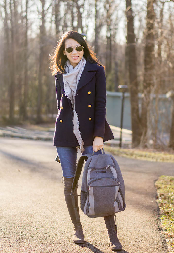 plaid scarf, navy pea coat, Mercedes-Benz backpack, gray top, skinny jeans, Stuart Weitzman Lowland over the knee boots