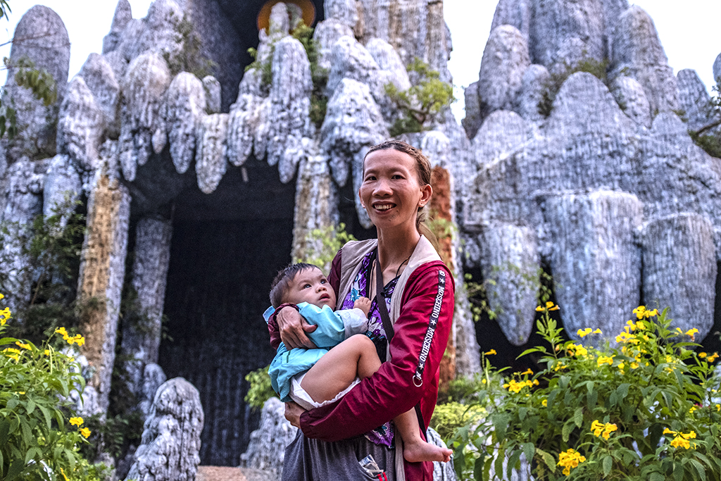 Odd woman and her baby at Tinh Quang Temple--Krong Buk