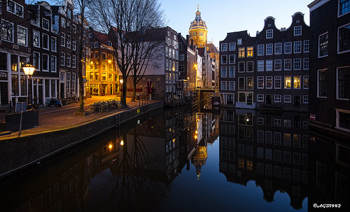 amsterdam canal dekolk stnicolaschurch bridge bikes earlymorning longexposure reflection sunrise architecture