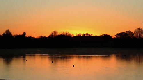 sanantoniotx woodlawnlake sunrise outdoorphotography silhouette reflection orangesky