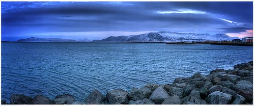 reykjavik iceland sea volcanic mountain ranges sky clouds weather weatherwatch winter view scene scenic image imageof imagecapture photography photoof outdoors outside rocks saebraut