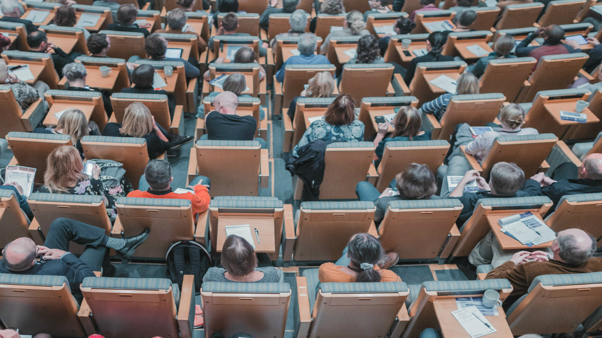 Birds eye view of students sat in a lecture hall