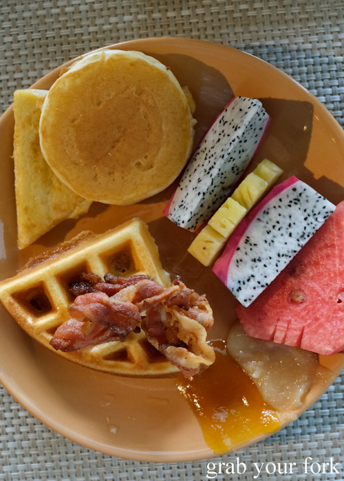 Buffet breakfast waffles and bacon with maple syrup at La Vela Hotel Resort in Khao Lak, Thailand