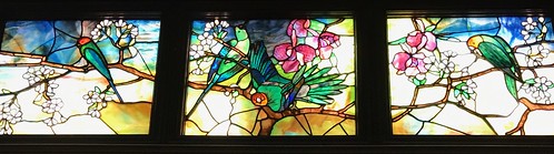 3 Panels showing plumed birds on Flowering branches Tiffany 1893, at the Halim Time and Glass Museum. From History Comes Alive Touring Chicago’s North Shore