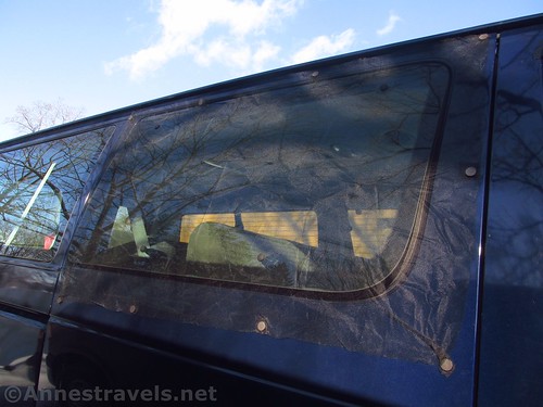 The finished bug screen on the side window of a Ford e150 van