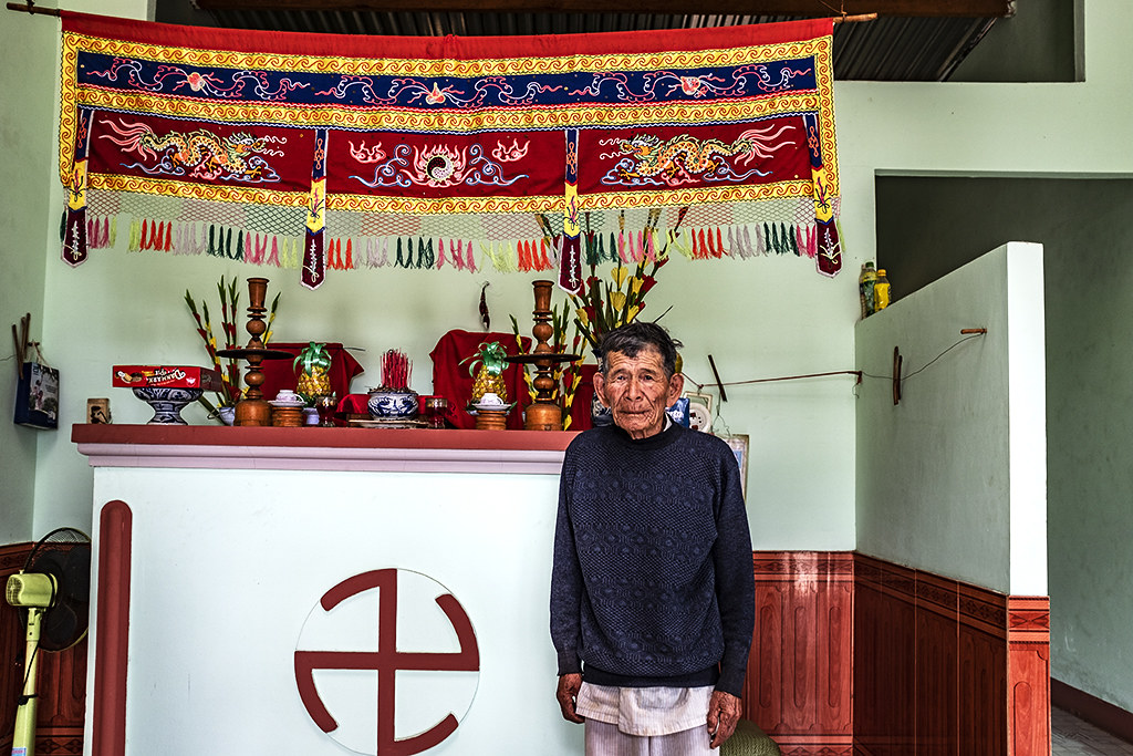 88-year-old man in front of his altar--Krong Buk