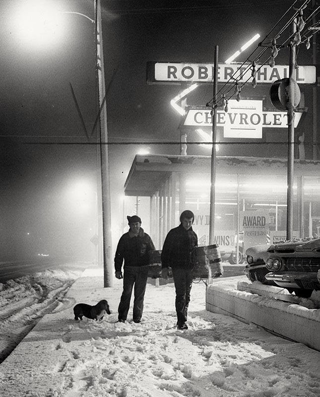 Los Angeles County Fire Capt. David Naranjo and his son, Bob, trudge through snow in Tujunga in January 1962.
