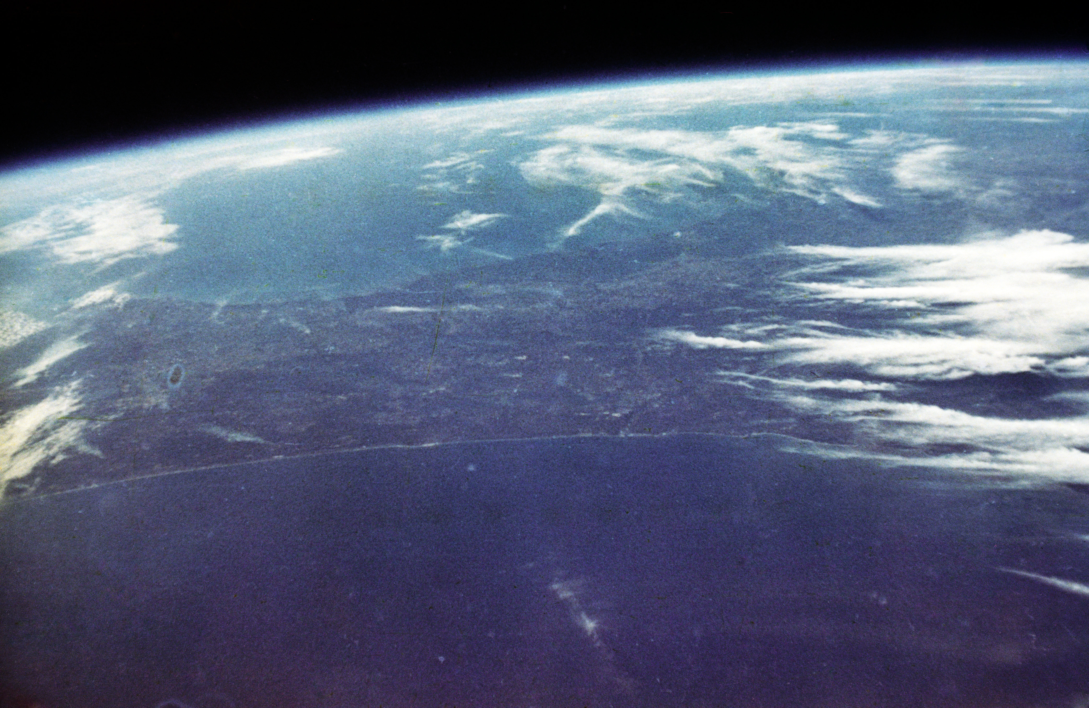 Photo of the Earth taken by John Glenn during Mercury Atlas 6/Friendship 7 orbital flight on February 20, 1962, with an Ansco Autoset, a rebadged Minolta Hi-Matic.