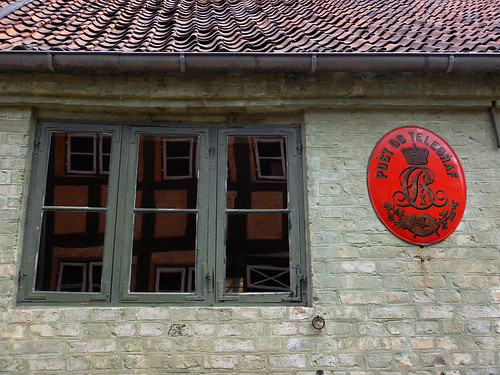 A Post Office with a red Telegraf sign at the recreated village of Den Gamle By in Aarhus, Denmark