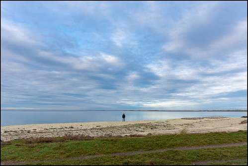 løgstør man alone lazyafternoon clouds sky beach grass limfjorden