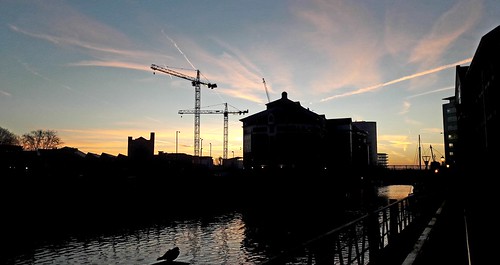 bristol water river sky blue red yellow buildings cranes structure national home outside nature light art sun clouds sunrise landscape city bridge bird trails old new reflecting reflected